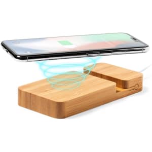A wooden wireless power bank with a sleek design, featuring a charging area for smartphones. It includes a logo.