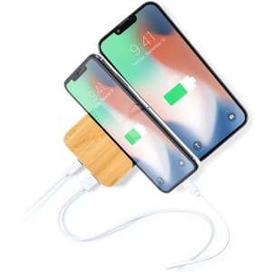 A bamboo power bank connected to two smartphones, showcasing a modern design and white charging cables.