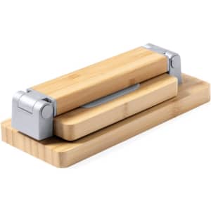 A bamboo roller press with a silver metal hinge, resting on a matching bamboo base.