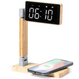 A multifunction alarm clock with a digital display, wooden stand, and a wireless charging pad for smartphones.