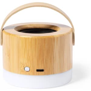 A bamboo Bluetooth speaker with a circular design, featuring a handle and a white base.