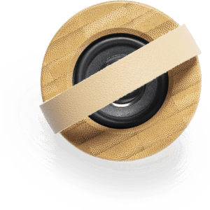 A round Durbal Speaker with a wooden exterior and a central black speaker, featuring a leather strap.