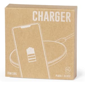 A silver wireless charger in a cardboard box featuring a logo and simple graphics.