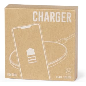 A silver wireless charger in a cardboard box, featuring a simple illustration of a phone on the packaging.