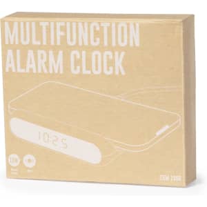 A brown packaging box containing a multifunction alarm clock with a digital display and a wireless charger.