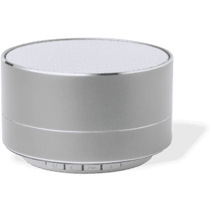 A silver compact speaker with a mesh top and control buttons on the base. It features a sleek, modern design.
