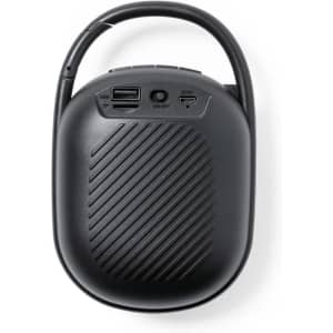 A black portable speaker featuring a handle, USB ports, and a textured surface.