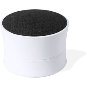 A round speaker with a white base and a dark grey fabric top, featuring a minimalist design and a logo.