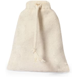 A cream drawstring pouch made of textured fabric, featuring a tassel and a simple design.