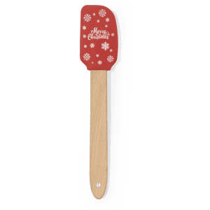 A red spatula with a wooden handle, featuring festive snowflakes and a "Merry Christmas" design.