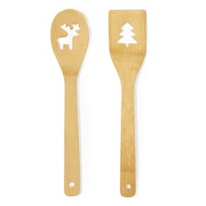 Two bamboo kitchen utensils featuring cut-out designs of a reindeer and a Christmas tree.