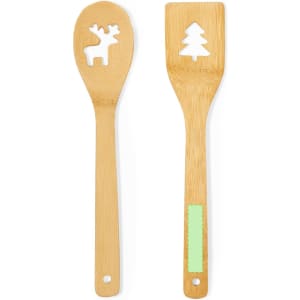 A bamboo cooking utensil set featuring a spoon with a reindeer cutout and a spatula with a tree design.