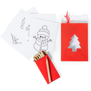 A red gift bag with a tree cutout, containing coloured pencils and several black and white activity sheets.