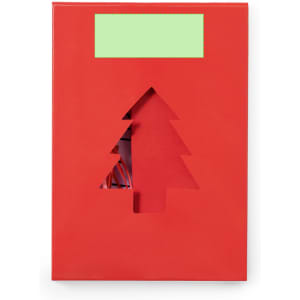 A red gift box with a cut-out Christmas tree design and a green label area.