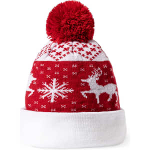 A red and white beanie hat featuring festive patterns, including reindeer and snowflakes, topped with a red pom-pom.