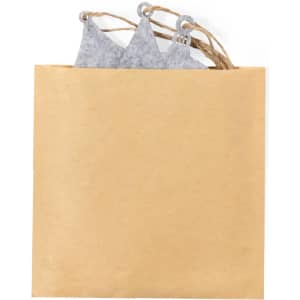 A brown paper bag with grey felt Christmas decorations peeking out, featuring decorative string handles.