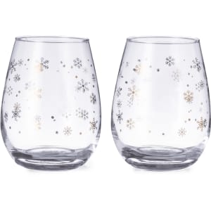 A set of clear glass cups with decorative snowflake patterns in silver and gold. Each cup has a rounded shape.