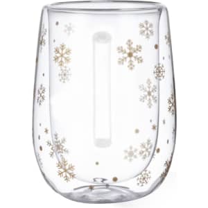 A glass mug featuring a clear design adorned with golden snowflakes and decorative dots.
