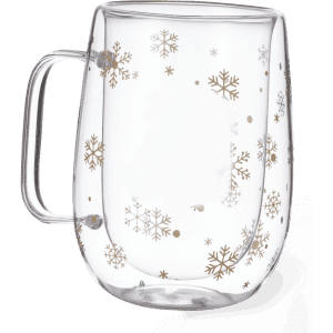 A clear glass mug with a handle, featuring decorative gold snowflakes on its surface.