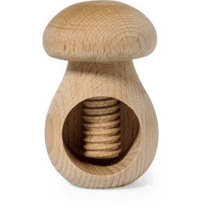 A wooden nutcracker with a mushroom design, featuring a light wood finish and a circular nut chamber.