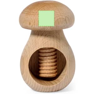 A wooden nutcracker shaped like a mushroom, featuring a smooth finish and natural grain. It has one logo.