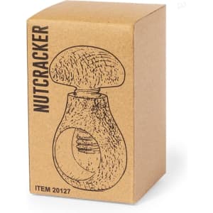 A nutcracker in a cardboard box featuring a simple design illustration. The box is light brown with a rustic look.