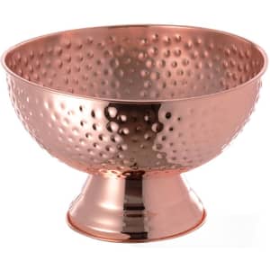 A polished copper champagne bucket with a hammered finish, featuring a stylish pedestal base.
