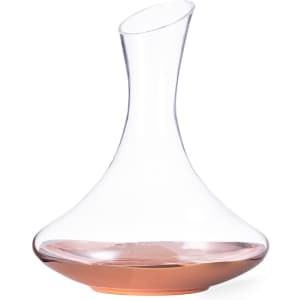 A glass wine decanter featuring a clear body and a rose gold base, elegant in design and shape.