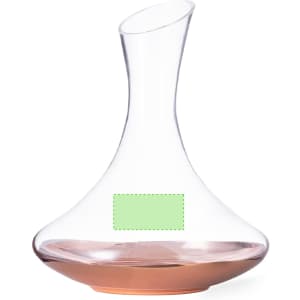 A glass decanter with a curved design and a copper base, featuring a blank label.