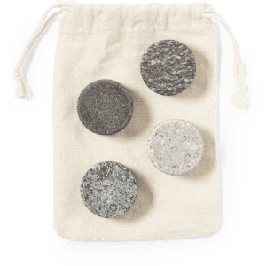 A drawstring bag containing four stone ice cubes in various shades of grey and black.