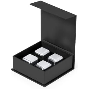 A black gift box containing four silver stone ice cubes. The box features a lid and a soft interior.