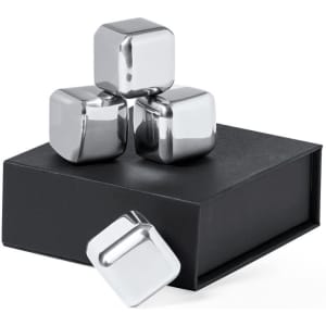 A set of four metallic silver ice cubes displayed on a black box. One cube is lying beside the box.