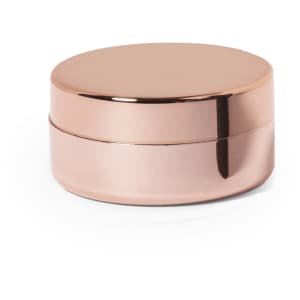 A rose gold lip balm container with a shiny finish, featuring a smooth, round lid and a compact design.