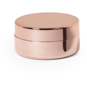 A rose gold lip balm container with a smooth, rounded lid and a metallic finish.