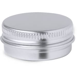 A silver metal lip balm container with a ribbed edge and a smooth top surface.