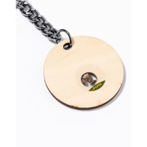 A round wooden keyring featuring a chain attachment, with a small viewable compartment in its centre.