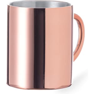A drink mug in a shiny rose gold finish with a metal handle and an interior that appears silver.