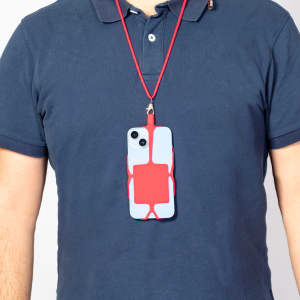 A red lanyard holding a phone case hangs around a person's neck, featuring a sleek design and a contrasting colour scheme.