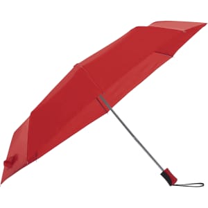 A red umbrella with a silver handle, featuring a strap and a branded logo.