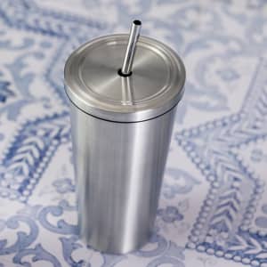 A drink bottle with a sleek stainless steel finish and a metal straw, featuring a lid with a hole.