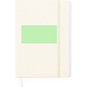 A cream notepad with a green rectangle on the front, featuring a ribbon bookmark and elastic closure.