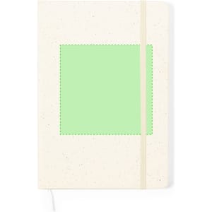A cream notepad with a green square on the front and an elastic band closure. It features a logo on the cover.