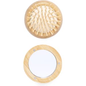 A wooden hairbrush with rounded bristles sits above a circular mirror, both featuring a natural finish.