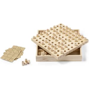 A wooden Sudoku skill game with a square base, featuring holes for pieces and several game cards beside it.
