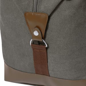 A green bag with brown accents and a metal clip, featuring a textured fabric for a stylish look.