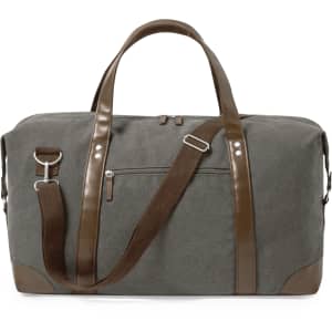 A grey duffle bag with brown accents and a detachable shoulder strap. It features handles and a zippered pocket.