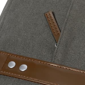 A grey document bag with brown leather accents and a zipper detail. Features snaps for secure closure.
