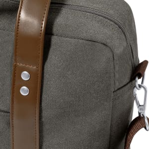 A grey laptop bag featuring a brown leather strap and metal detailing. It has a sleek, modern design.