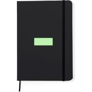 A notepad with a black cover, featuring a rectangular area in green and an elastic band closure.
