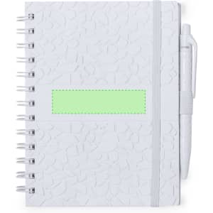 A white notebook with a textured cover, featuring a green label and a matching pen attached.